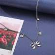 Silver-Plated Bow Heart Station Necklace on Sale