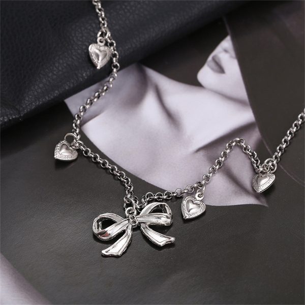 Silver-Plated Bow Heart Station Necklace on Sale