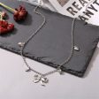 Silver-Plated Bow Heart Station Necklace on Sale