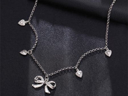 Silver-Plated Bow Heart Station Necklace on Sale