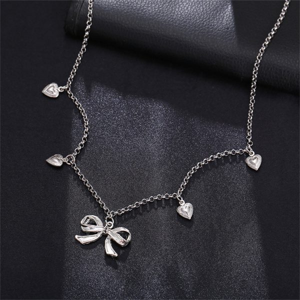 Silver-Plated Bow Heart Station Necklace on Sale